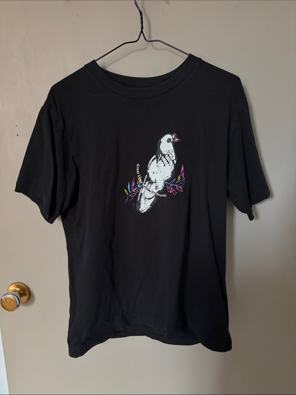 Uniqlo Black Tee with White Bird and Neon Accents